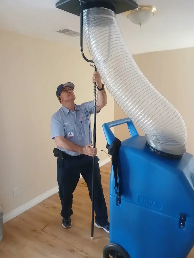 Furnace Tune-Up technician using HEPA equipment in Paramus